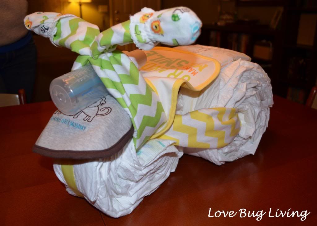 http://www.lovebugliving.com/2013/03/diaper-tricycle-cake.html