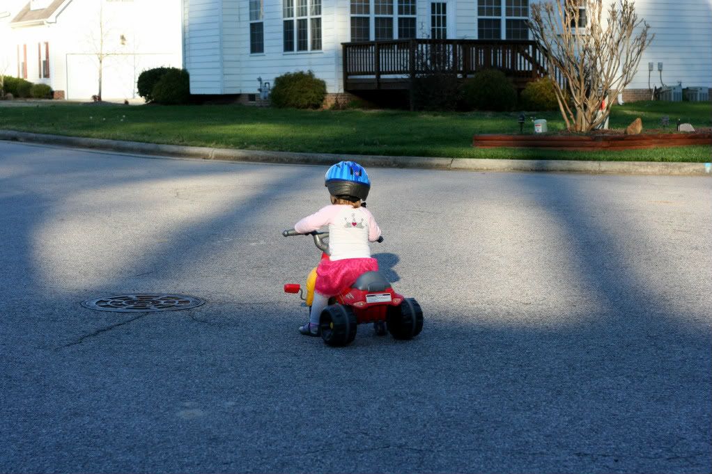 Lorelai riding the tricycle